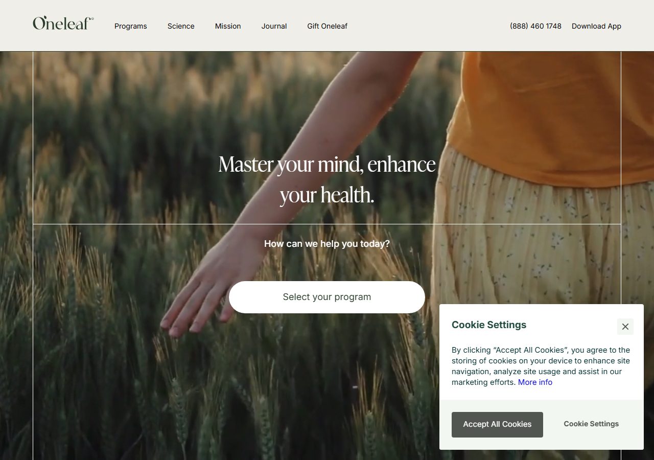 Oneleaf homepage with a person walking through tall grass, a programme selector, and a cookie-settings panel